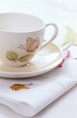 A cup, saucer and a napkin