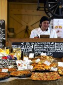 A baker selling his wares at a Farmer's Market in England