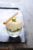 A layered dish with peas and mascarpone cream