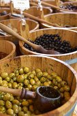 Preserved olives in barrels at a market