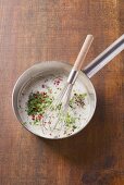 Creamy herb sauce with pink pepper