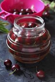 A jar of preserved cherries