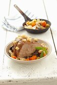 Braised beef peppered with bacon and vegetables (Poland)