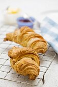 Two croissants on cake rack