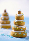 Christmas trees (stacked biscuits with icing & sugar pearls)