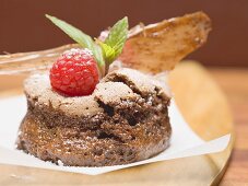 Chocolate soufflé with raspberries and caramel