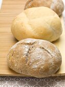 A kaiser roll and a rye roll