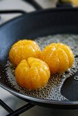 Glazing clementines in sugar syrup