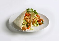Two chicken wraps on plate