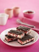 Chocolate-coated cherry and coconut slices