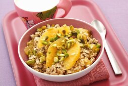 Muesli with pistachios and orange segments