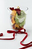 Vegetable crisps with guacamole in glass