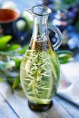 Olive oil with rosemary and spices in carafe