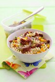 Pasta salad with dried tomatoes, onions and yellow pepper