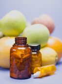 Tablets in front of fresh fruit