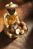 Gilded statuette with baby coconuts