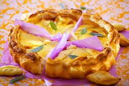 Cheese tart with sage leaves