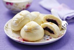 Steamed yeast dumplings with blackberry filling & whipped cream