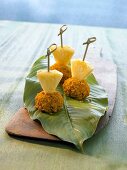Meatballs in peanut and turmeric crust with pineapple