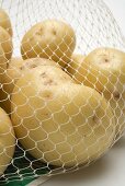 Potatoes in a net bag (close-up)