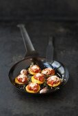 Polenta rounds with tomato sauce, cheese and herbs
