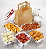 Take-away food: several dishes in aluminium containers
