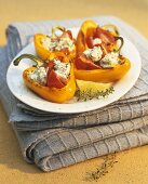 Baked, stuffed yellow peppers with herb quark filling