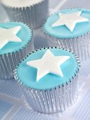 Cupcakes with blue icing and stars