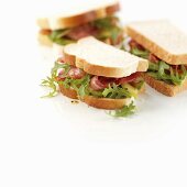 Bacon, avocado and rocket sandwiches