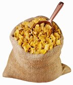 Cornflakes in jute sack with scoop