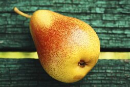 A pear on a wooden background