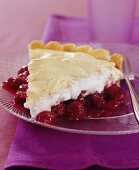 A piece of cherry tart with meringue