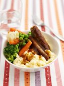 Sausage and mash with vegetables