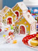 Gingerbread houses with candy canes and sweets