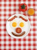 Bacon, egg, sausage and tomato for breakfast (smiley face)