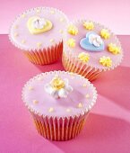 Fairy cakes with pink icing and sugar flowers