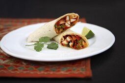 A wrap filled with chicken and vegetables