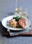Atlantic salmon and potato cakes fried with maple syrup