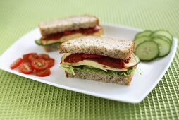 A cheese, gherkin and tomato sandwich