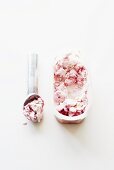 Raspberry-vanilla ice cream with ice cream scoop