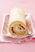 Sponge roll with mascarpone and pomegranate seeds
