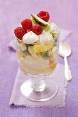 An ice cream sundae with vanilla ice cream, fresh fruit and meringue