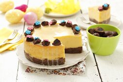 Cheese cake with chocolate-covered plums for Easter