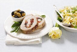 Pork roulade filled with dried tomatoes and olives