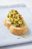 A slice of bread topped with avocado chilli cream