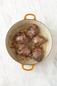 Braised veal cheeks in a pan