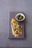 Onion toast with anchovies and olives