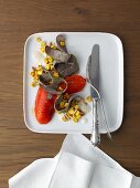 Bison Bratwurst-Tagliata on pine nut - corn kernel salad and roasted peppers