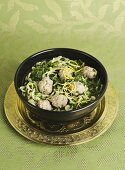 Kale soup with meatballs and lemon zest