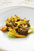 Sweet and sour beef with bok choy and mango